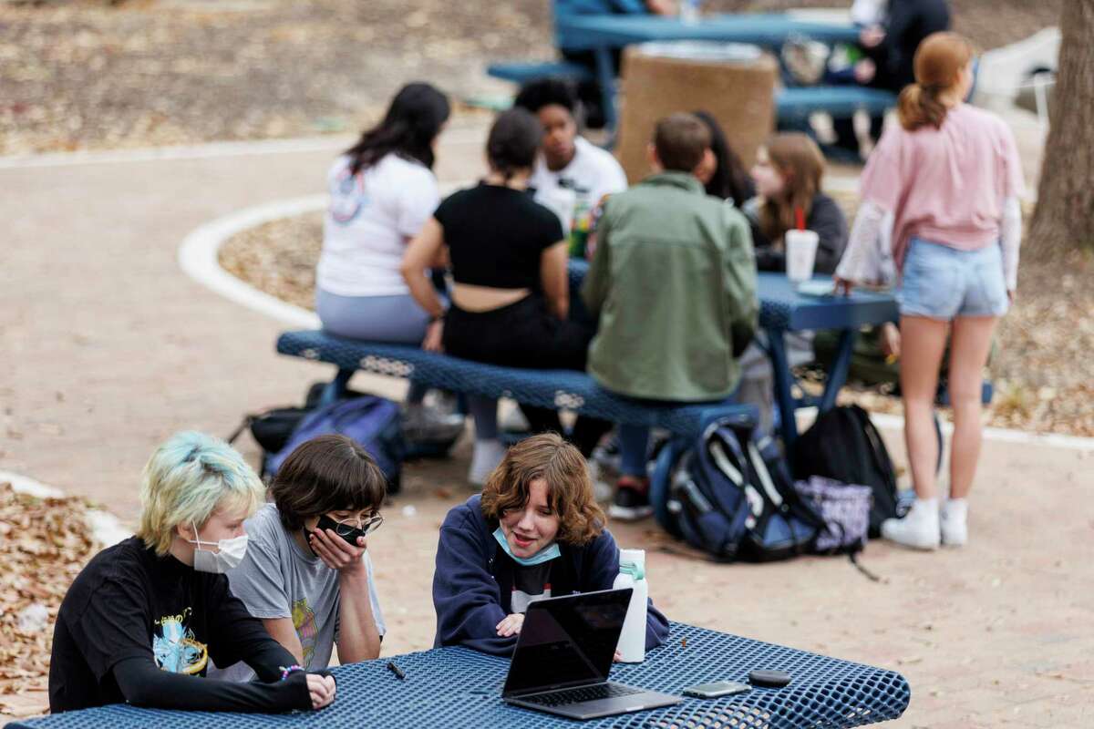 Students spread out outside during their lunch break at Alamo Heights High School on Thursday afternoon, March 17, 2022. The students are now able to eat lunch inside or outside without major social-distancing restrictions.