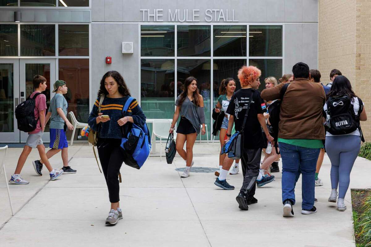 Students walk to leave the cafeteria and walk to their classes at Alamo Heights High School on Thursday afternoon, March 17, 2022.