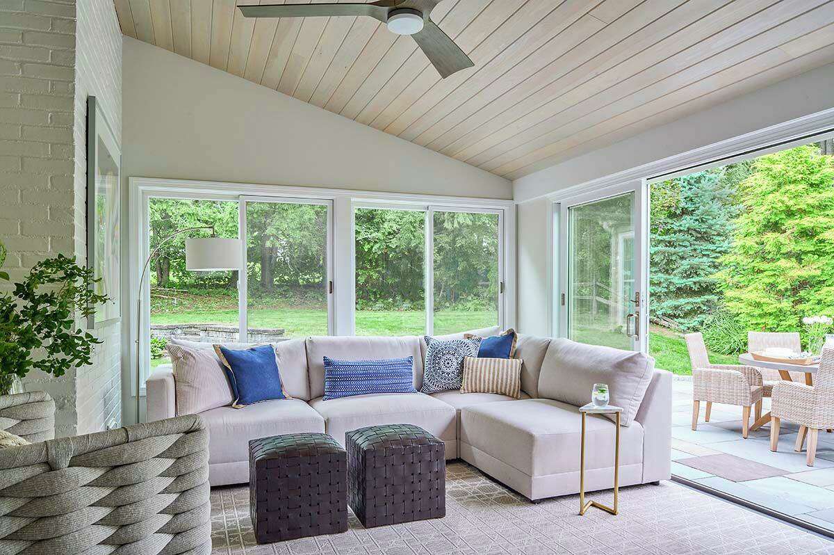 The sunroom is a totally reimagined space, going from a storage area for sports equipment and  other items to a tranquil spot for relaxing and enjoying nature. 