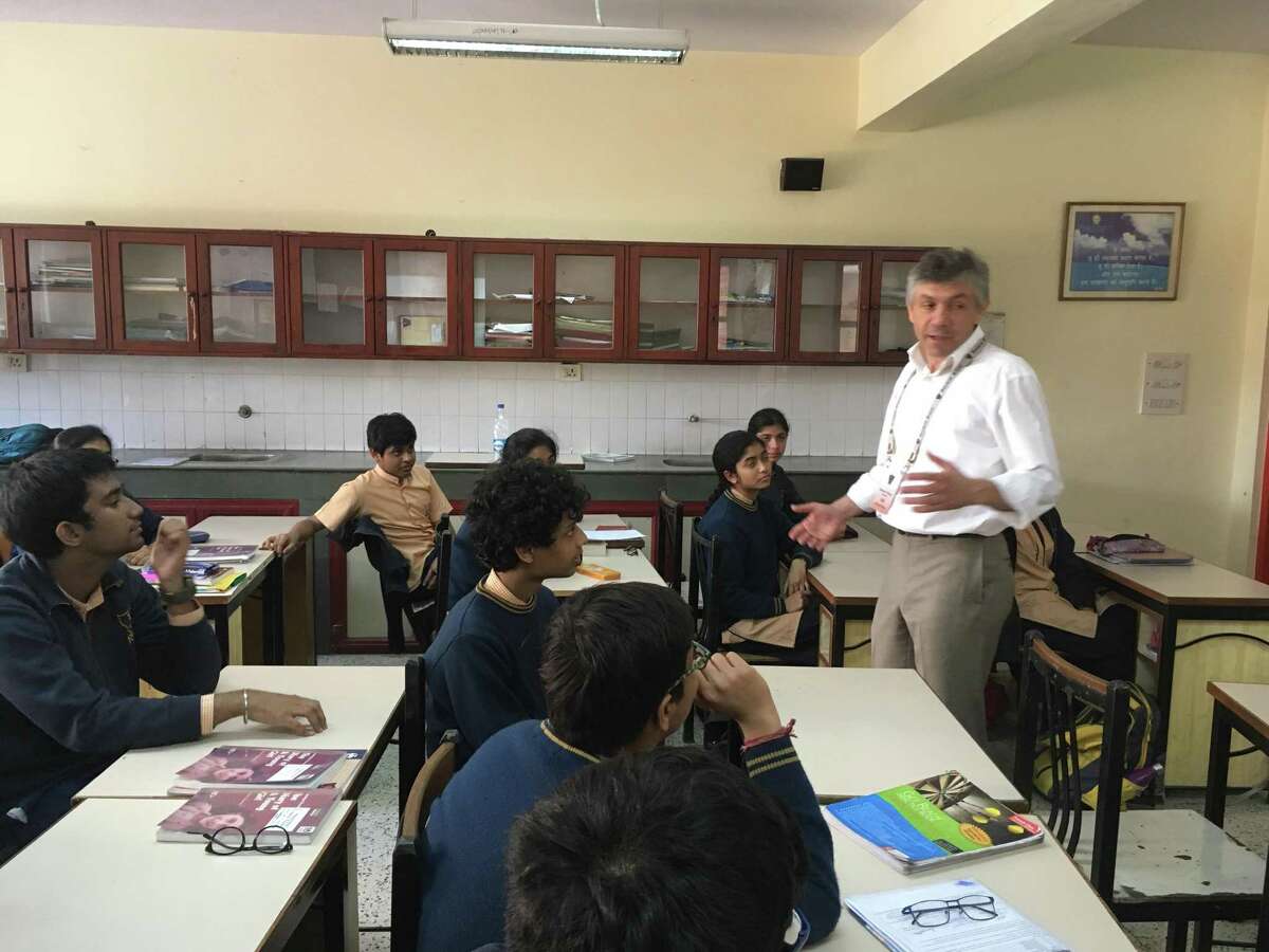 Valentin Dumitrascu discusses history and international politics with high school students in New Delhi, India as part of the Fulbright Scholarship program in 2017.
