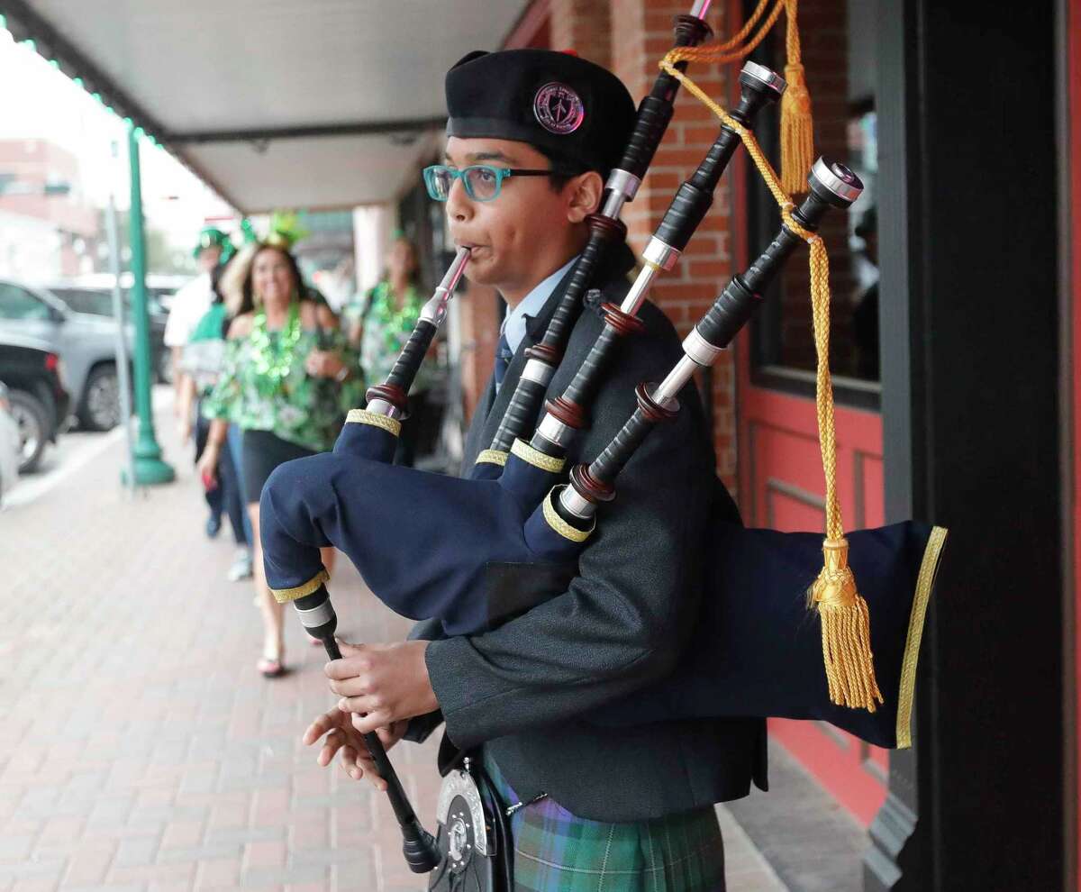 Mihir Zambre plays the bagpipes before the annual St. Patrick’s Day walking parade through downtown Conroe, Thursday, March 17, 2022, in Conroe.