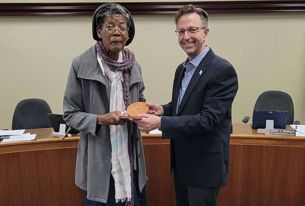 Mayor Art Risavy, right, presents the latest Excellence in Edwardsville Award to Sandy Deal, a crossing guard at Columbus Elementary School since 1978!