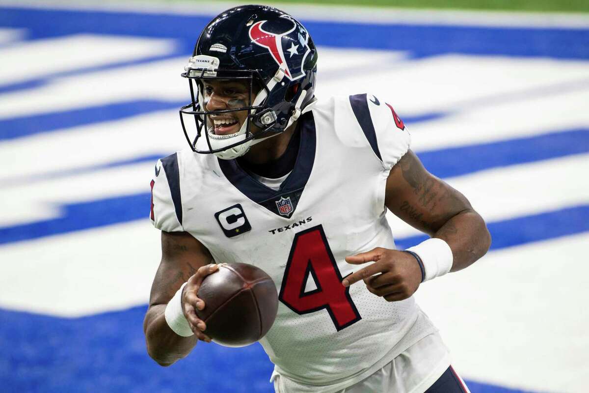 FILE - Houston Texans quarterback Deshaun Watson (4) celebrates a touchdown during the team's NFL football game against the Indianapolis Colts on Dec. 20, 2020, in Indianapolis. Several teams are scrambling to find a quarterback. Some of those, including Carolina, New Orleans and Cleveland, have been in discussions with Watson, who sat out last season. (AP Photo/Zach Bolinger, File)