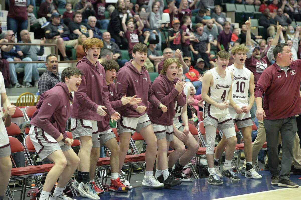 Stillwater basketball players react to a basket made by teammates on the court during their Class C state semifinal match against Salamanca at Cool Insuring Arena in Glens Falls, N.Y., on Friday, Mar. 18, 2022. (Jenn March, Special to the Times Union)