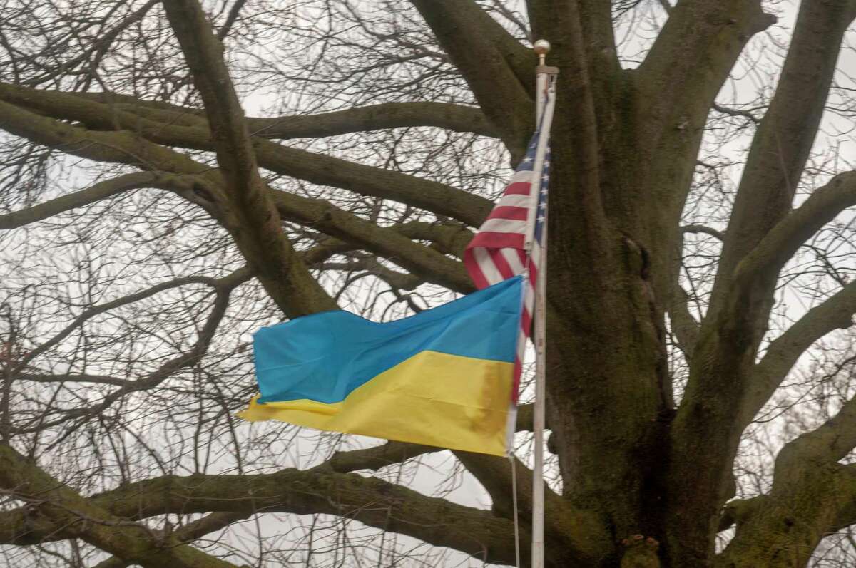 A Ukrainian flag flies below the American flag on Walnut Street in Jacksonville to show support for the people of Ukraine during the Russian invasion.