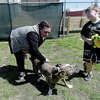 Megan Neely and son Colin Neely spend time getting to know some of the dogs in the play area as they look for a new dog at the Beaumont Animal Shelter, which is holding a spring adoption event that continues Friday until 5 p.m. and Saturday 10 a.m. - 4 p.m. Adoption fees are only $20 and include a micro-chip, spay/neuter, flea prevention, de-wormer and full vaccinations. The no-kill shelter currently has nearly 100 dogs in need of a home. Photo made Friday, March 18, 2022 Kim Brent/The Enterprise