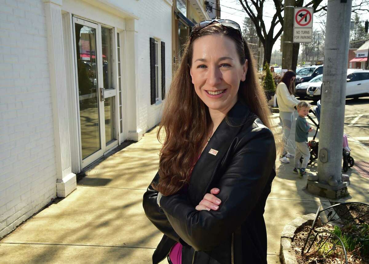 Erika Kurt, a promoter of getting women into science and STEM and who is featured at a new exhibit at the Smithsonian, poses along Sound Beach Avenue in Old Greenwich on Friday March 18, 2022.