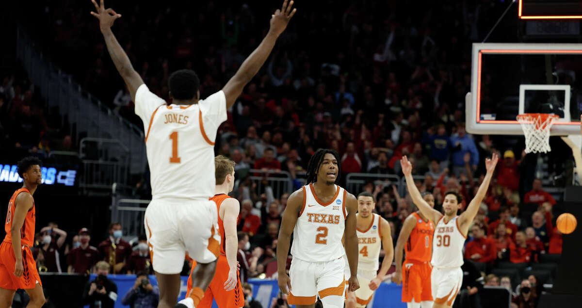 Texas's Marcus Carr celebrates after making the final shot in the first half of a first round NCAA college basketball tournament game against Virginia Tech Friday, March 18, 2022, in Milwaukee. (AP Photo/Jeffrey Phelps)