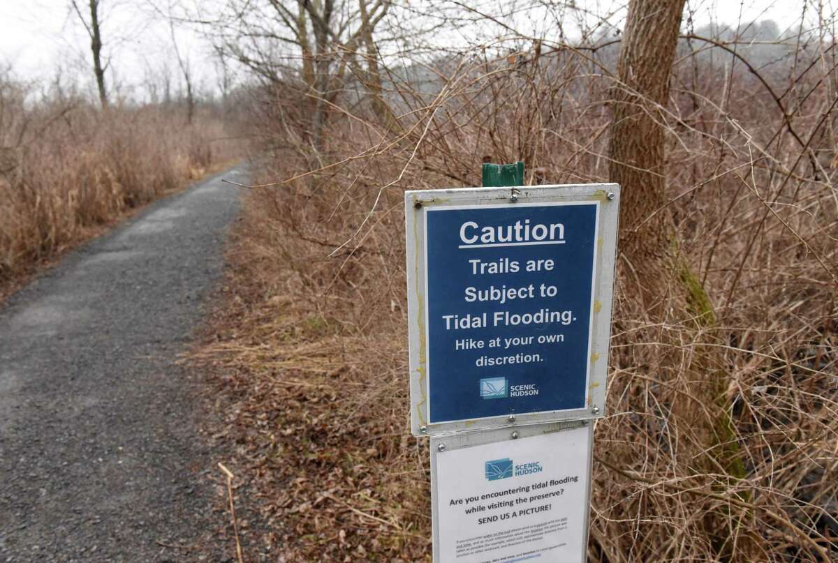 Signs warn visitor of potential flooding from the Hudson River at RamsHorn-Livingston Audubon Sanctuary on Thursday, March 17, 2022, in Catskill, N.Y.