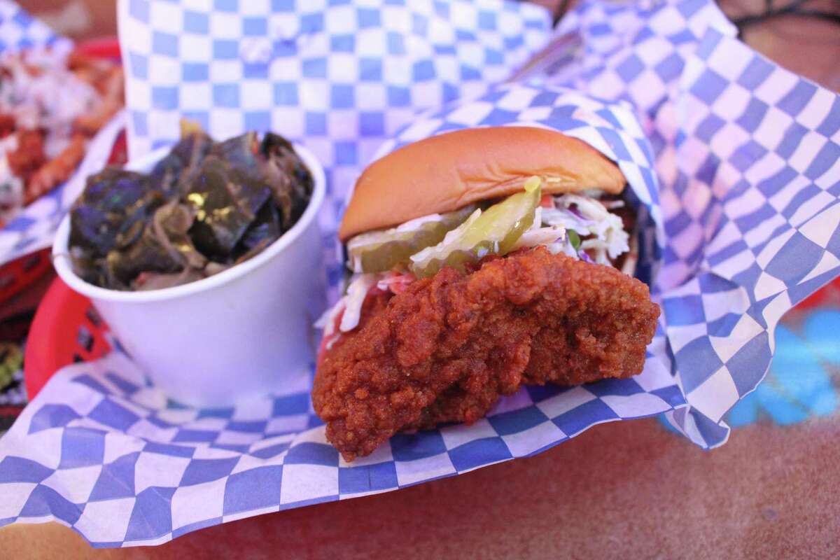 A Nashville-inspired hot chicken sandwich with a side of collard greens at World Famous Hotboys in Walnut Creek.