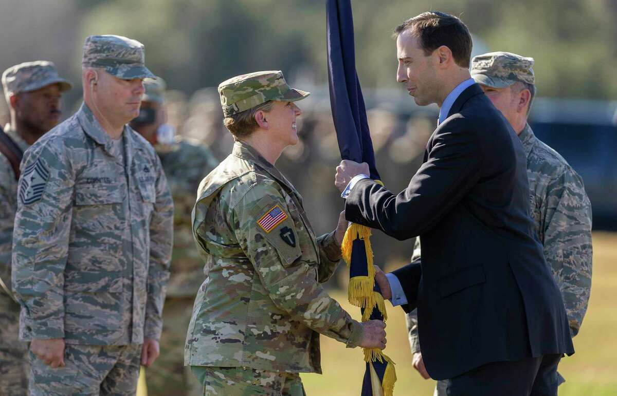 Maj. Gen. Tracy R. Norris receives the Texas Military Department flag from Secretary of State David Whitley as she becomes the first female adjutant general of Texas during a change of command ceremony at Camp Mabry in Austin in 2019.