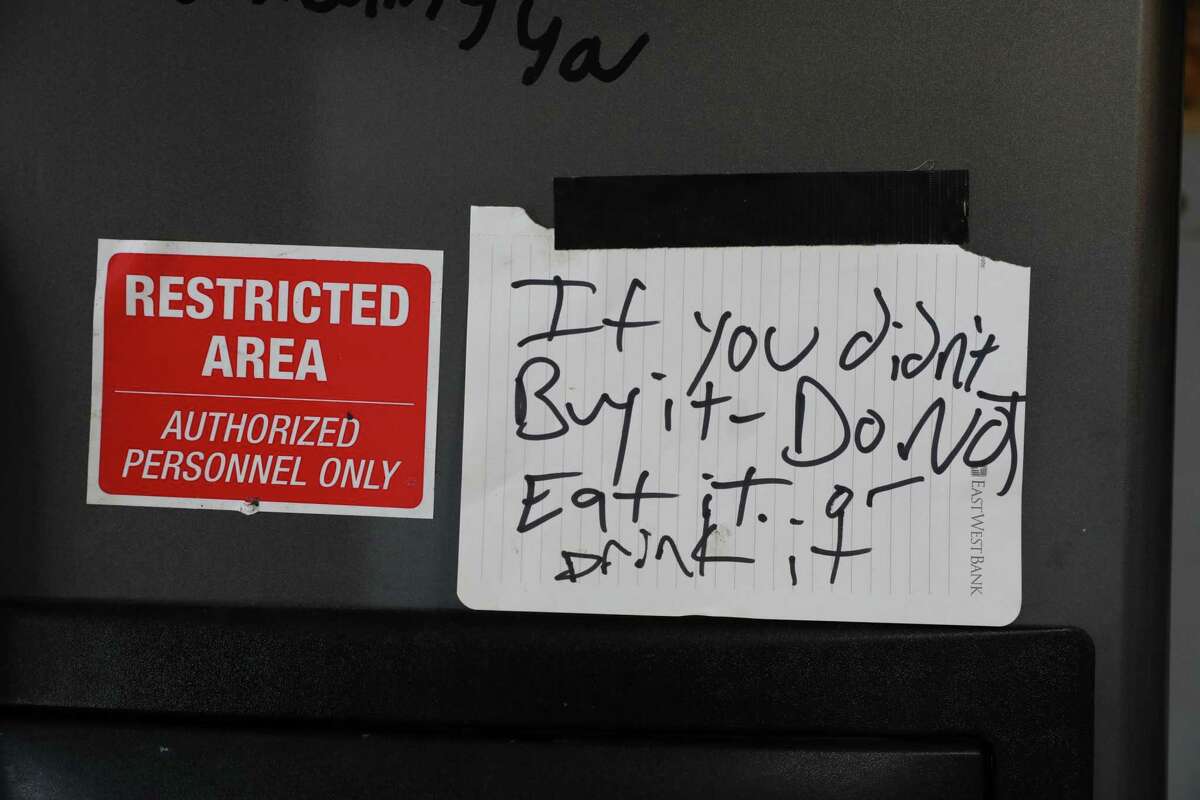 A sticker, writing on the refrigerator and a sign are some of the damage left over from squatters who trespassed and lived in the home of a Bernal Heights couple.