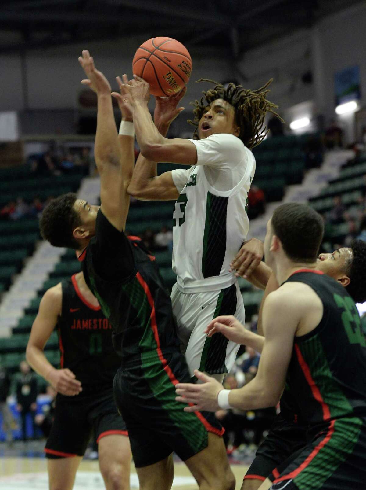 Green Tech’s Zaveon Little rises from a sea of Jamestown players to shoot the ball during their Class AA state semifinal match at Cool Insuring Arena in Glens Falls, N.Y. on Friday, Mar. 18, 2022. (Jenn March, Special to the Times Union)