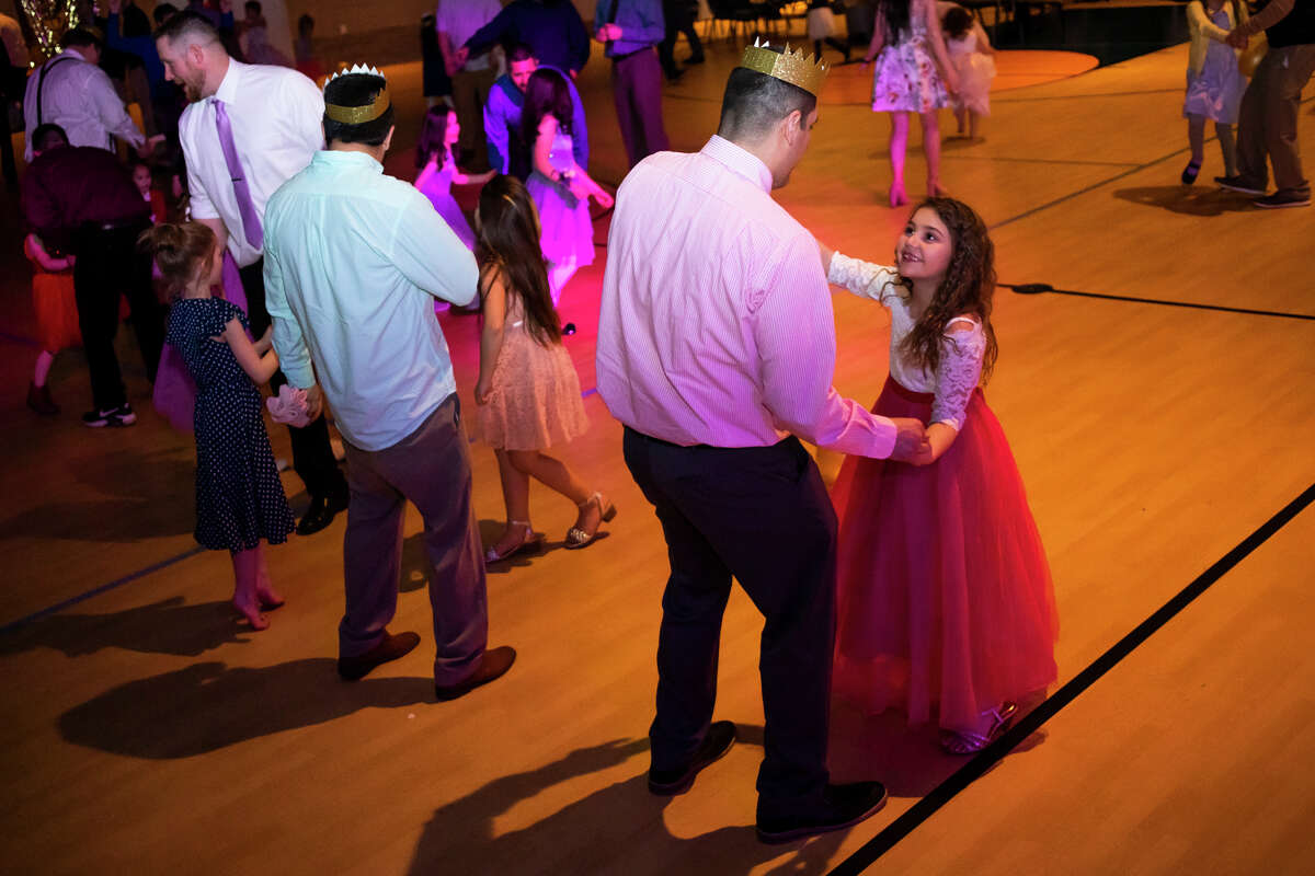 Nick Kohn dances with his daughter, Paisley Kohn, 7, during a Father Daughter Dance Friday, March 18, 2022 at Midland Free Evangelical Church in Midland.