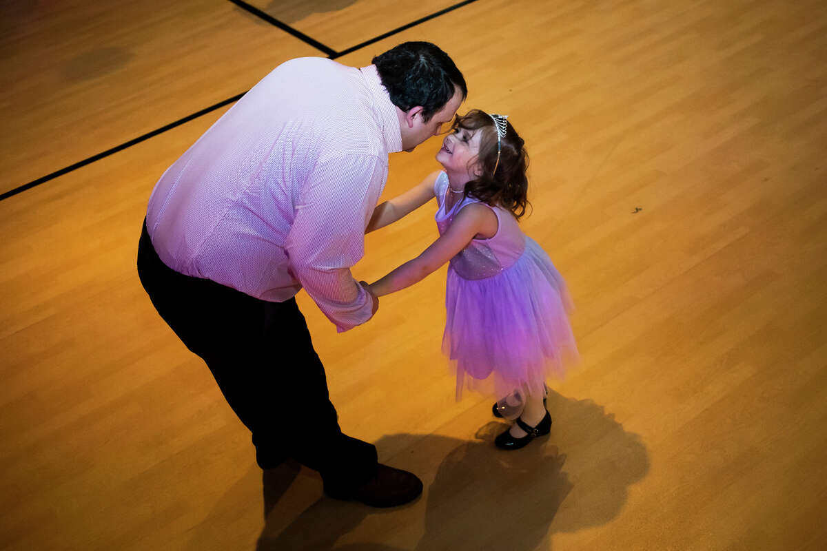 Chance Harrington dances with his daughter, Ever Harrington, 5, during a Father Daughter Dance Friday, March 18, 2022 at Midland Free Evangelical Church in Midland.