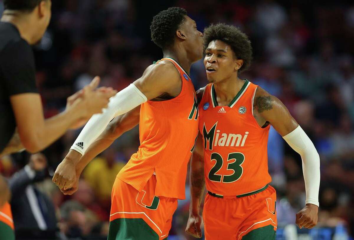 Kameron McGusty (23) of Miami celebrates with a teammate after scoring during the first half against USC.