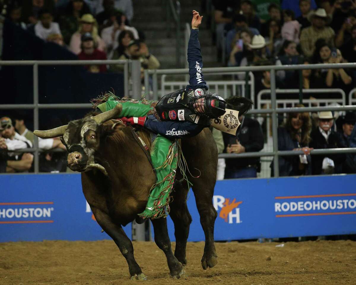 Josh Frost scores 70.0 in bull riding during the wild card at Houston Livestock Show and Rodeo Friday, March 18, 2022, at NRG Stadium in Houston.