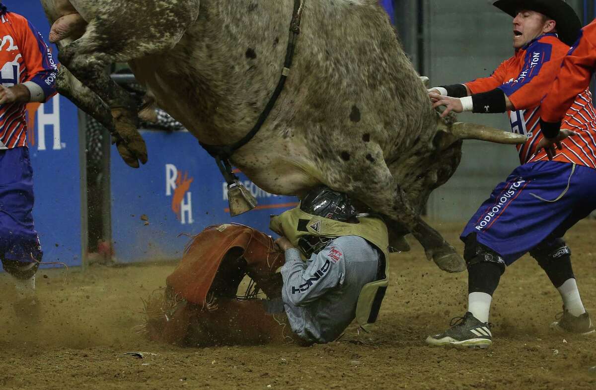 Trevor Kastenr is bucked off in bull riding during the wild card at Houston Livestock Show and Rodeo Friday, March 18, 2022, at NRG Stadium in Houston.during the wild card at Houston Livestock Show and Rodeo Friday, March 18, 2022, at NRG Stadium in Houston.