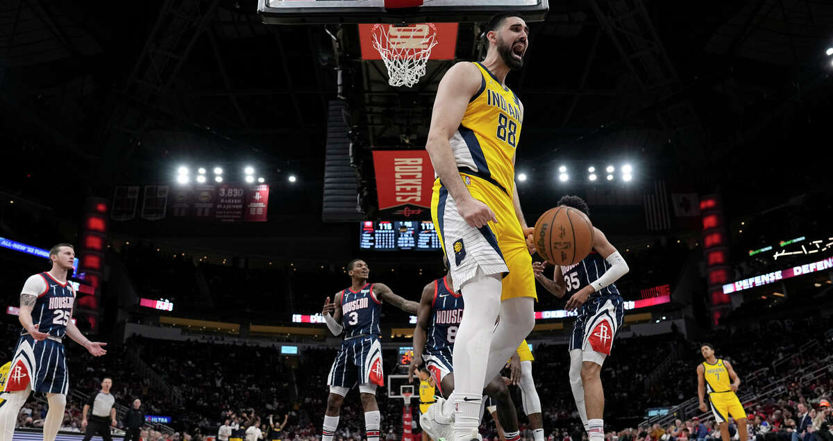 Indiana Pacers' Goga Bitadze (88) reacts after dunking the ball against the Houston Rockets during the second half of an NBA basketball game Friday, March 18, 2022, in Houston. The Pacers won 121-118. (AP Photo/David J. Phillip)