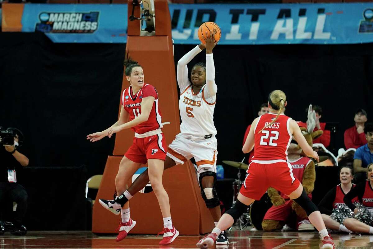 Texas forward DeYona Gaston (5) grabs a rebound next to Fairfield forward Lou Lopez-Senechal (11) during the first half of a college basketball game in the first round of the NCAA women's tournament Friday, March 18, 2022, in Austin, Texas. (AP Photo/Eric Gay)