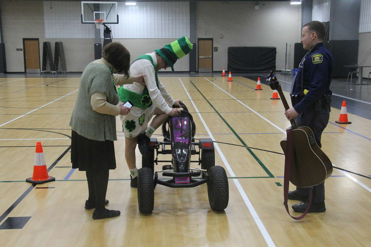 Raymond Bugg, of the Bugg's, tested out the MSP's Fatal Vision Pedal Cars with goggles on.