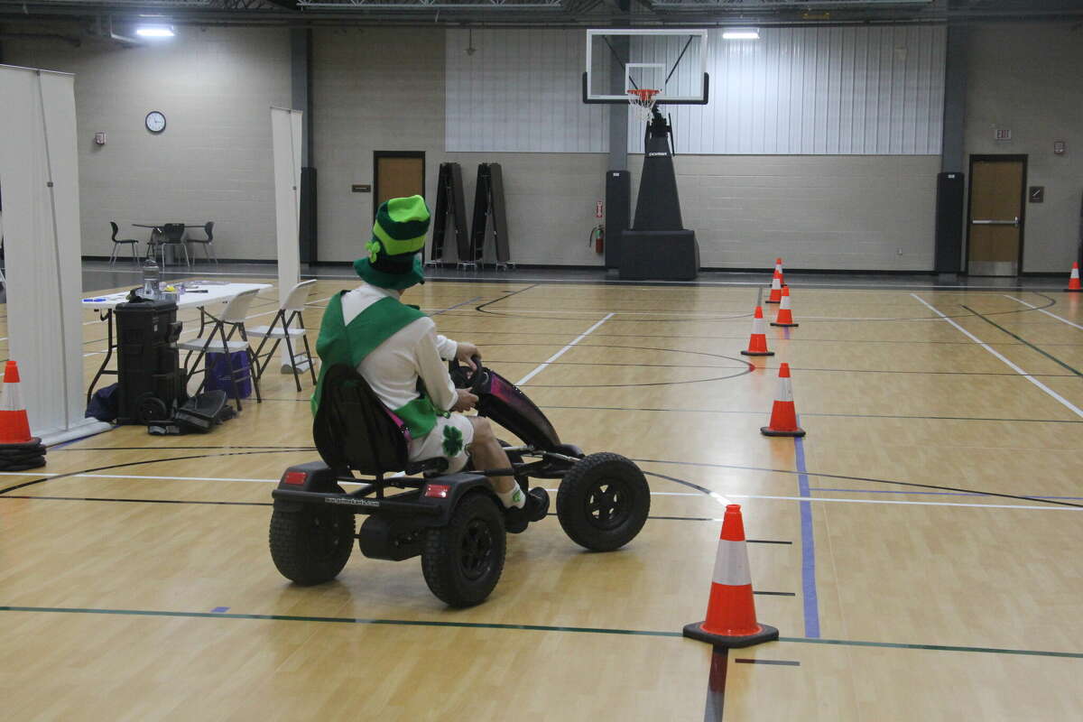 Raymond Bugg, of the Bugg's, tested out the MSP's Fatal Vision Pedal Cars with goggles on.
