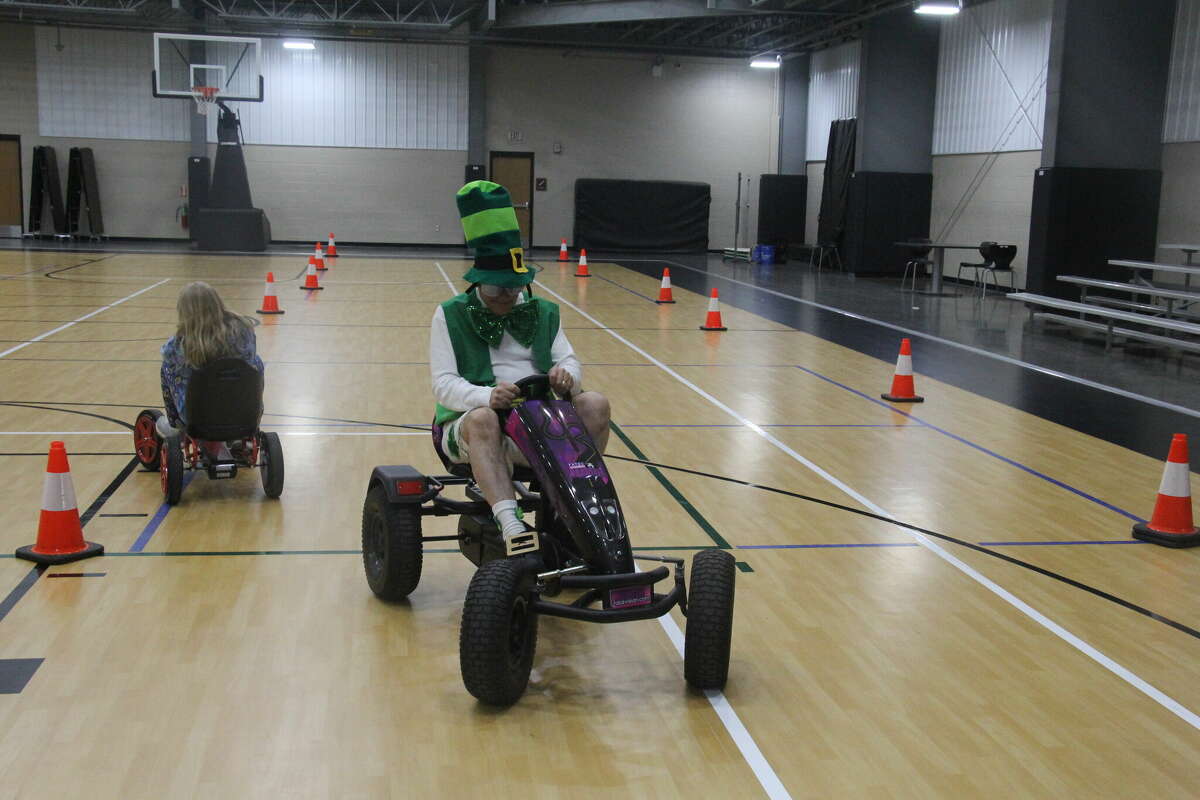 Raymond Bugg, of the Bugg's, tested out the MSP's Fatal Vision Pedal Cars with goggles on.