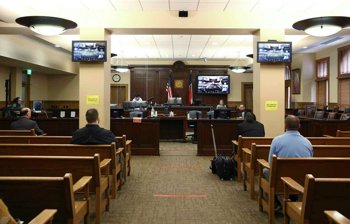 Courthouse proceedings are once again done in person, but a hybrid system has emerged that also relies on videoconferencing technology, as in state District Judge Laura Salinas’ civil docket call Thursday.