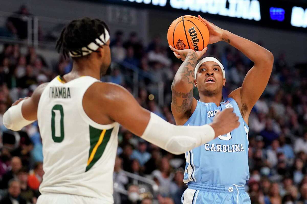 North Carolina forward Armando Bacot (5) shoots over Baylor forward Flo Thamba (0) in the first half of a second-round game in the NCAA college basketball tournament in Fort Worth, Texas, Saturday, March, 19, 2022. (AP Photo/Tony Gutierrez)