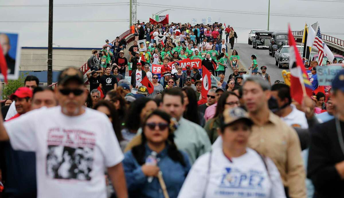 Hundreds of participants walk along the Guadalupe Street bridge during the 20th Annual César E. Chávez March for Justice on March 26, 2016.