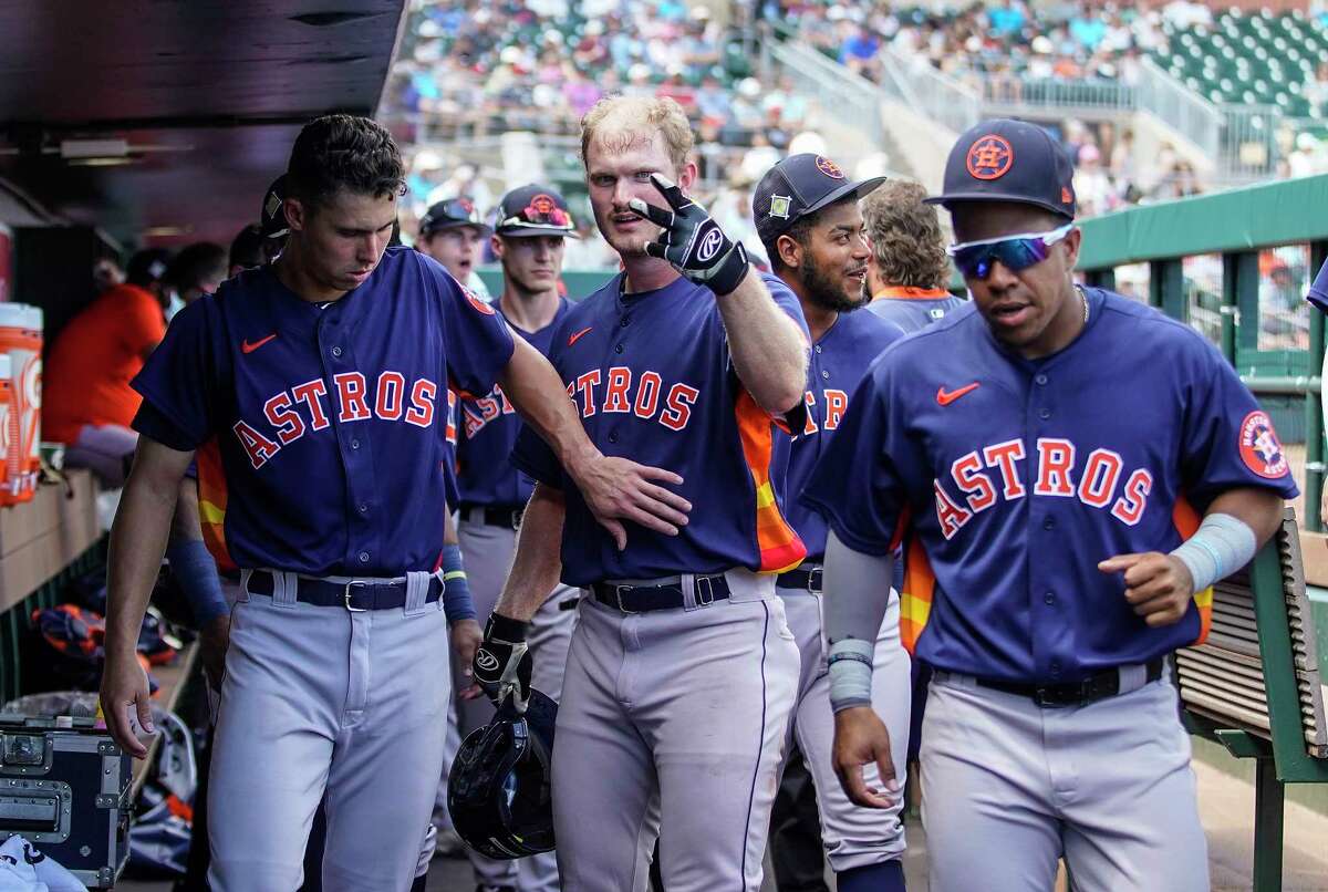Houston Astros Peter Zimmerman gestures after scoring a run on Wilyer Abreu’s double in the third inning during a MLB spring training game at Roger Dean Chevrolet Stadium on Saturday, March 19, 2022 in Jupiter .