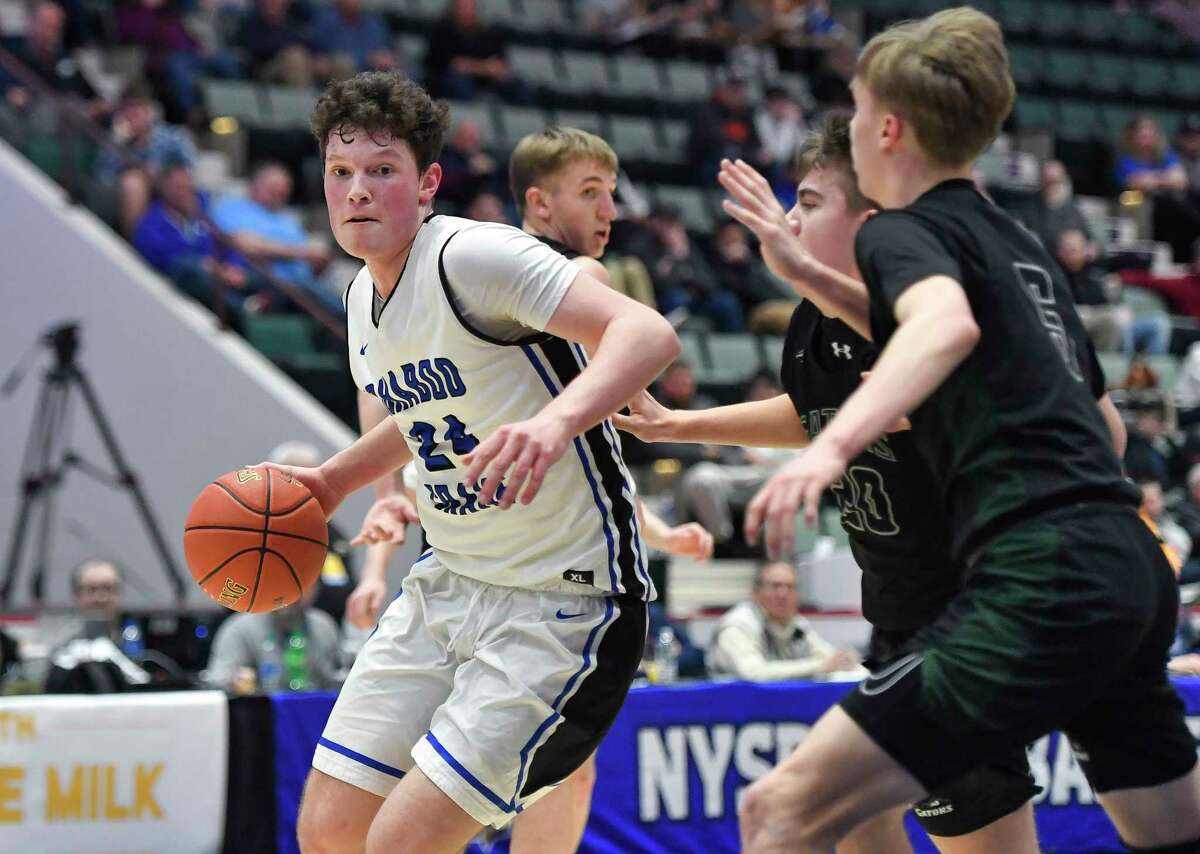 Ichabod Crane's Brett Richards, left, drives to the basket against Allegany-Limestone during a Class B semifinal at the NYSPHSAA Boys Basketball Championships in Glens Falls, N.Y., Saturday, March 19, 2022.
