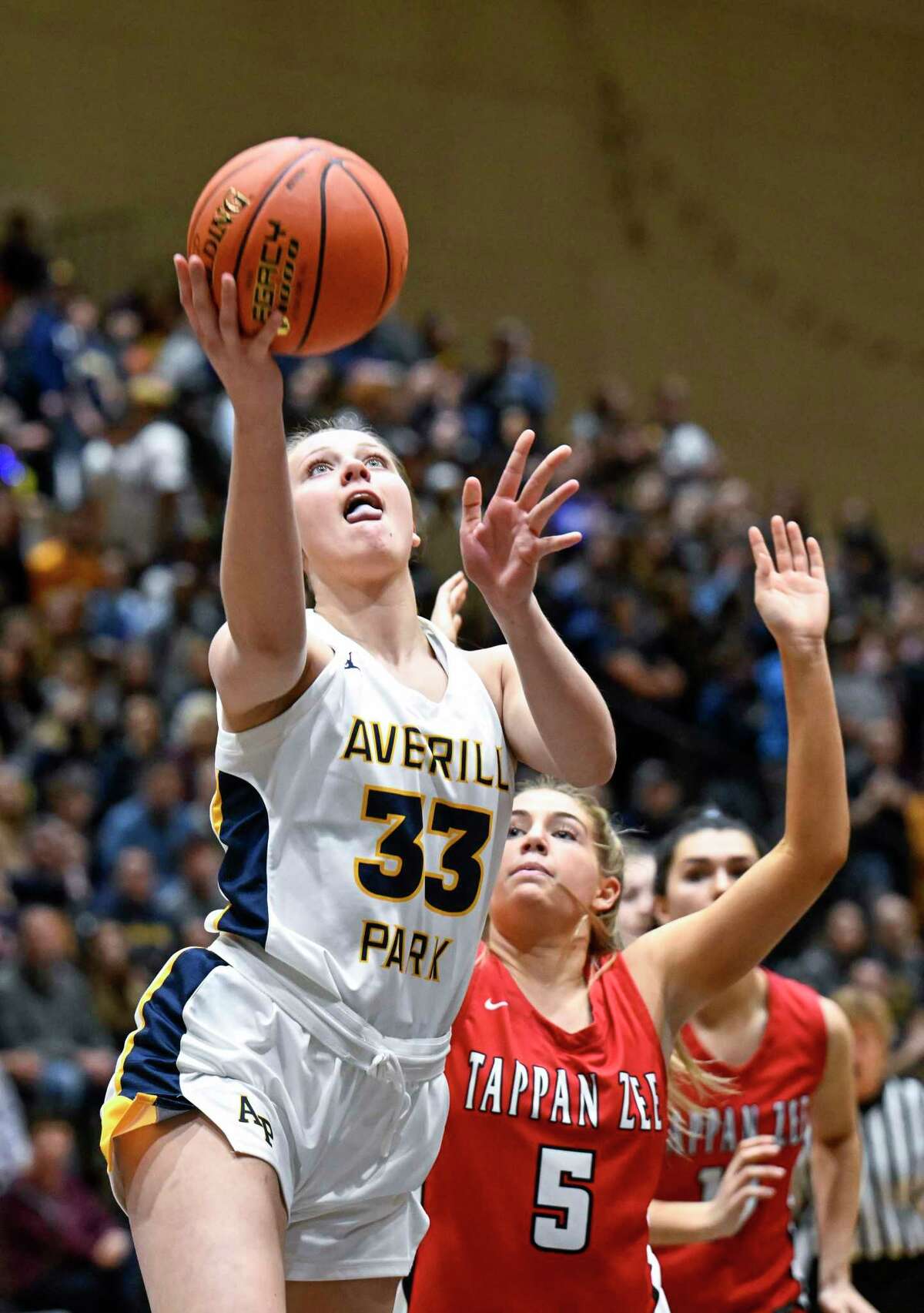 Averill Park's Amelia Wood (33) drives to the basket against Tappan Zee's Kellie Linehan (5) during the New York State Public High School Athletic Association girls' Class A final basketball game on Saturday, March 19, 2022, in Troy, N.Y.