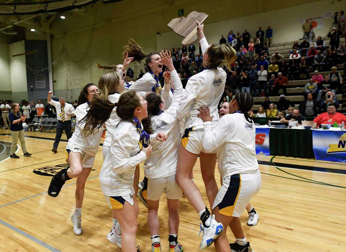 Averill Park players celebrate a 54-48 win against Tappan Zee during the New York State Public High School Athletic Association girls' Class A final basketball game on Saturday, March 19, 2022, in Troy, N.Y.