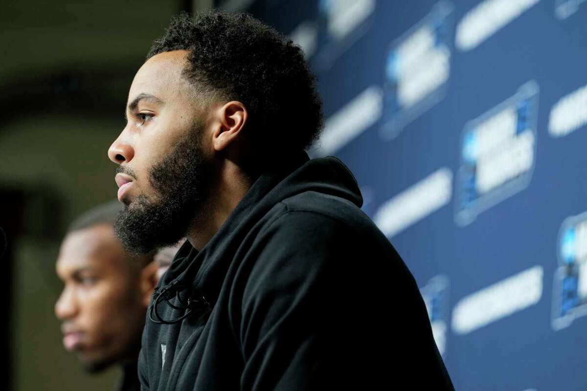 Houston guard Kyler Edwards listen to questions during a news conference leading into the second round in the NCAA men's college basketball tournament Saturday, March 19, 2022, in Pittsburgh. The Cougars play Illinois in the second round of the tournament.