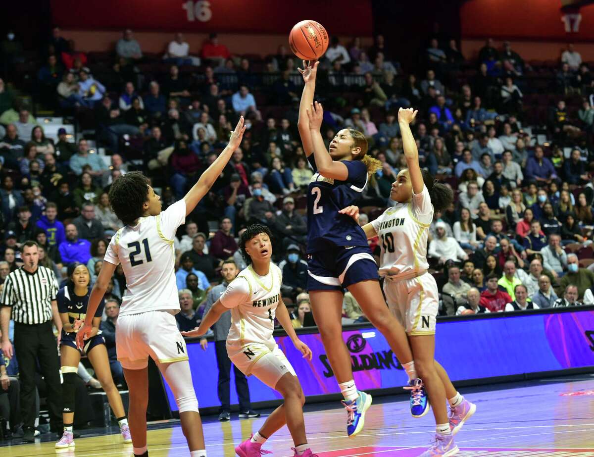 Notre Dame of Fairfield's Aizhanique Mayo (2) lays up to score against Newington during Girls basketball Class L state championship action at Mohegan Sun Arena in Uncasville, Conn., on Saturday March 19, 2022.