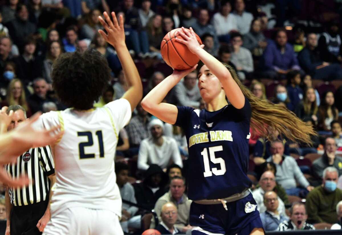Notre Dame of Fairfield's Sarah Macary (15) attempts a shot against Newington during Girls basketball Class L state championship action at Mohegan Sun Arena in Uncasville, Conn., on Saturday March 19, 2022.