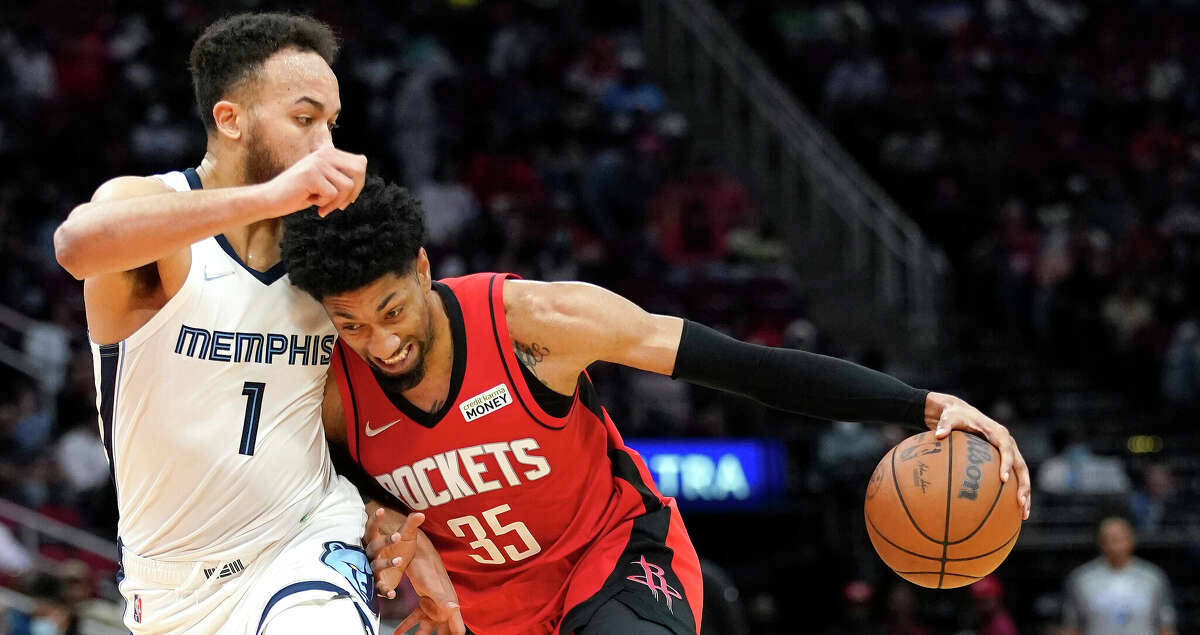 Houston Rockets center Christian Wood (35) pushes against Memphis Grizzlies forward Kyle Anderson (1) during the second half of an NBA basketball game at Toyota Center on Sunday, March 6, 2022 in Houston.