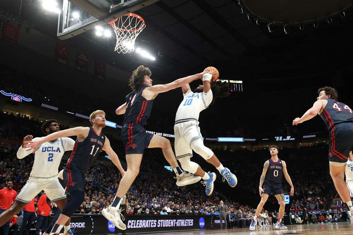 PORTLAND, OREGON - MARCH 19: Kyle Bowen #14 of the St. Mary's Gaels blocks a shot by Tyger Campbell #10 of the UCLA Bruins during the first half in the second round of the 2022 NCAA Men's Basketball Tournament at Moda Center on March 19, 2022 in Portland, Oregon. (Photo by Ezra Shaw/Getty Images)