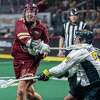 Albany FireWolves forward Charlie Kitchen takes a shot in front of Georgia Storm defender Ryan MacSpadyen during a National Lacrosse League game at the MVP Arena in Albany, NY, on Saturday, March 19, 2022. (Jim Franco/Special to the Times Union)