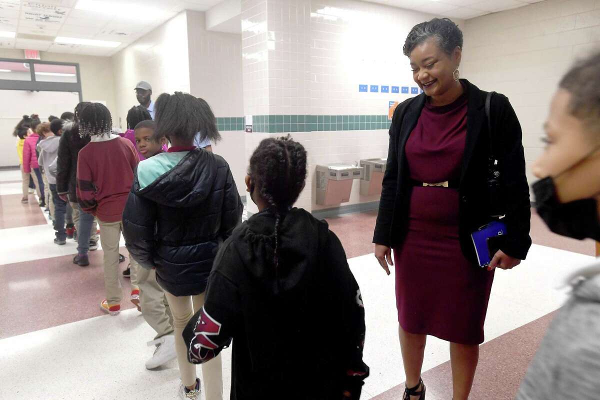 BISD Assistant Superindent Dr. Anita Frank observes students as they exit a performance by symphony members during a stop at Dishman Elementary. Photo made Thursday, March 10, 2022 Kim Brent/The Enterprise