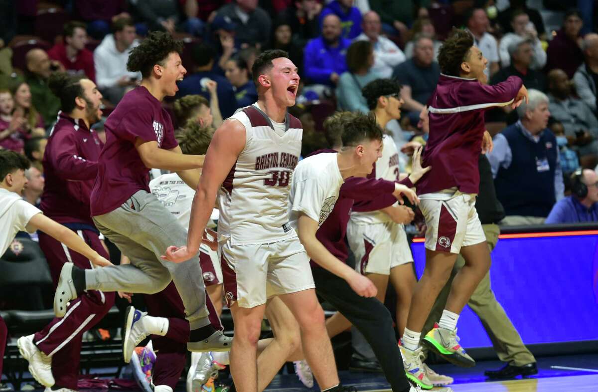 Bristol Central celebrates its win over Northwest Catholic in Div. II Boys Basketball state championship action at Mohegan Sun Arena in Uncasville, Conn., on Saturday March 19, 2022.