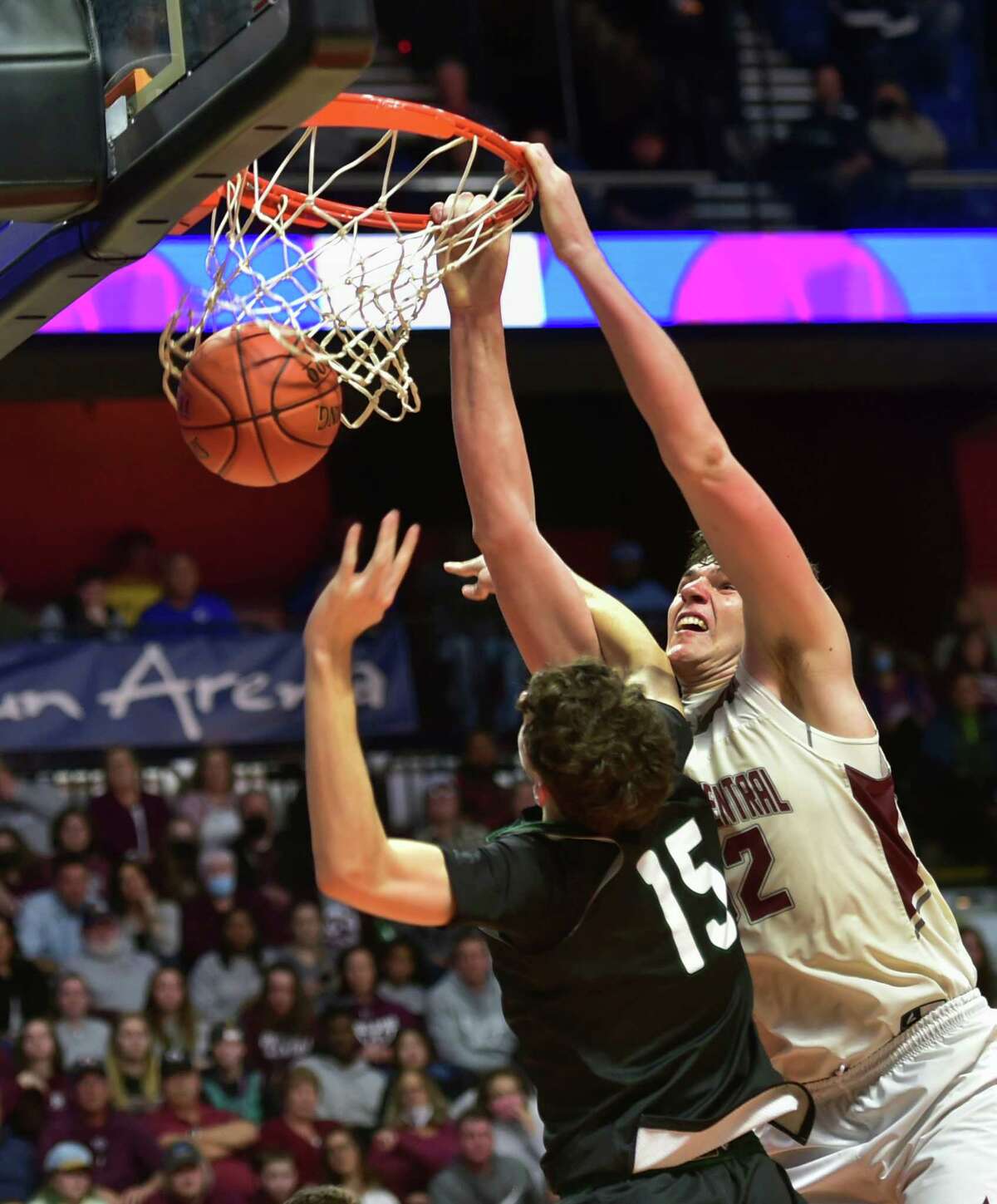 Bristol Central's Donovan Clingan (32) slam dunks the ball during Div. II Boys Basketball state championship action against Northwest Catholic at Mohegan Sun Arena in Uncasville, Conn., on Saturday March 19, 2022.