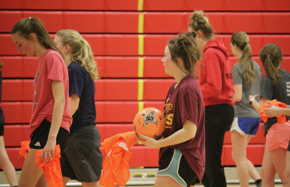 Reed City girls soccer players get set to finish up a practice on Friday.