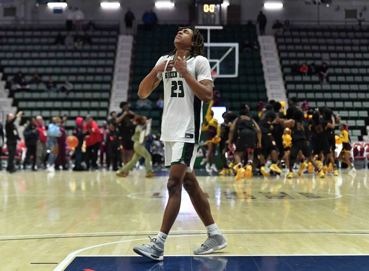 Green Tech's Zaveon Little walks off the court as Mount Vernon celebrates their win in the Class AA final at the NYSPHSAA Boys Basketball Championships in Glens Falls, N.Y., Saturday, March 19, 2022. (Adrian Kraus / Special to the Times Union)