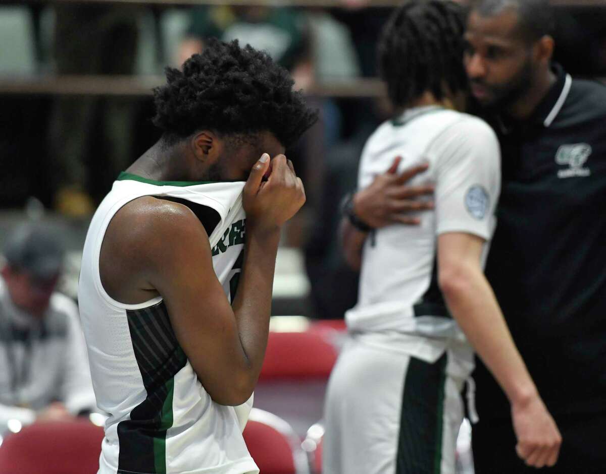 Green Tech's Zhaji Williams, left, reacts after losing to Mount Vernon in the Class AA final at the NYSPHSAA Boys Basketball Championships in Glens Falls, N.Y., Saturday, March 19, 2022. (Adrian Kraus / Special to the Times Union)