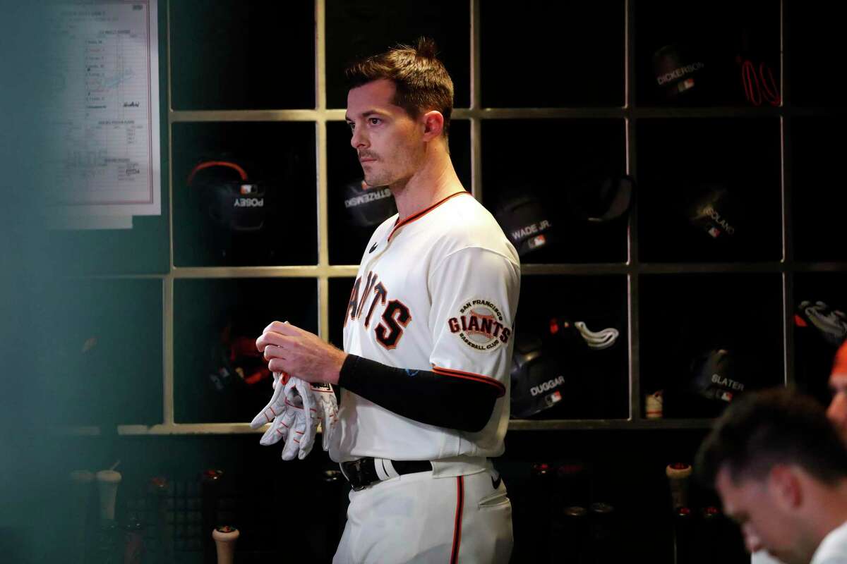 San Francisco Giants' Mike Yastrzemski in dugout after popping up in 2nd inning against Los Angeles Dodgers during NLDS Game 5 at Oracle Park in San Francisco, Calif., on Thursday, October 14, 2021.