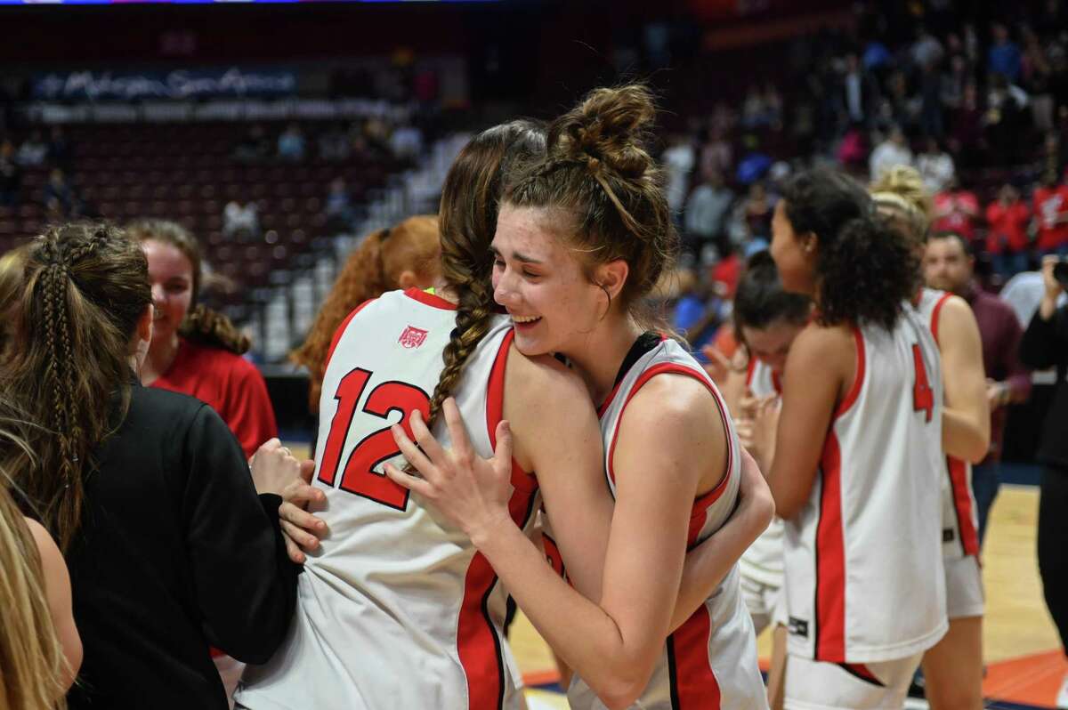 Sacred Heart Academy celebrates winning the CIAC Class MM Girls Basketball Championship on Sunday March 20, 2022 played at Mohegan Sun Arena in Uncasville, CT.