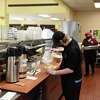 Kitchen staff prepare meals at Warren, Washington, and Albany Counties ARC (WWAARC) on Friday, March 18, 2022, at WWAARC in Albany N.Y.