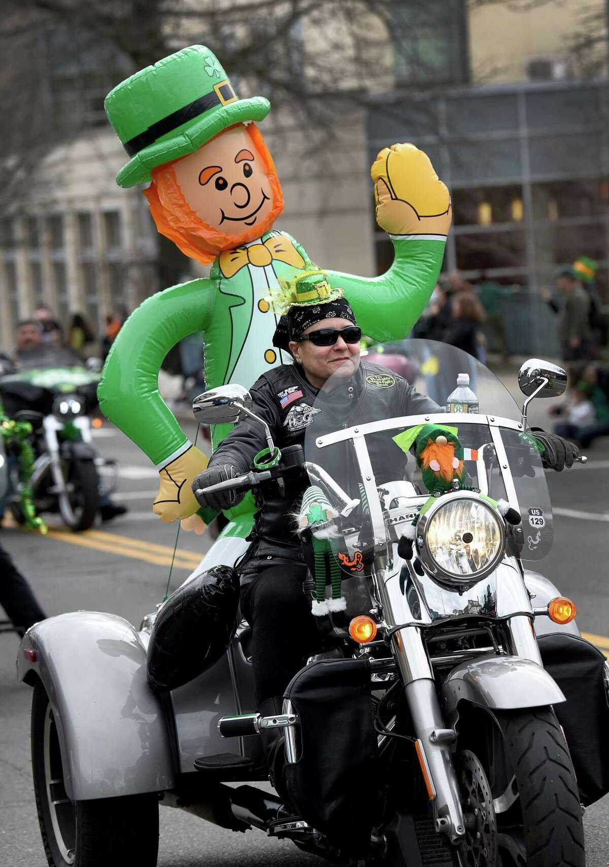 Shulie Weiss rides with a leprechaun in Sunday's parade. Greenwich's annual St. Patrick's Day Parade is held Sunday, March 20, 2022, after a two year break due to Covid-19 restrictions.